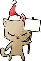 niedlicher farbverlaufskarikatur einer katze mit dem zeichen, das weihnachtsmütze trägt vektor