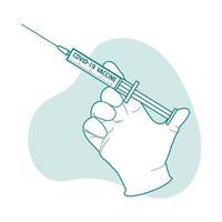 behandschuhte Hand mit Covid 19 Impfstoff