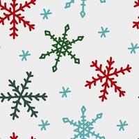 snöflingor handritad vektormönster med traditionella julfärger vektor