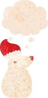 tecknad björn bär julhatt och tankebubbla i retro texturerad stil vektor