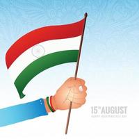 hand som håller indiska flaggan med glad självständighetsdagen bakgrund vektor