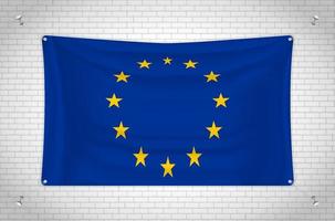 flagge der europäischen union, die an der mauer hängt. 3D-Zeichnung. Flagge an der Wand befestigt. Ordentliches Zeichnen in Gruppen auf separaten Ebenen für eine einfache Bearbeitung. vektor