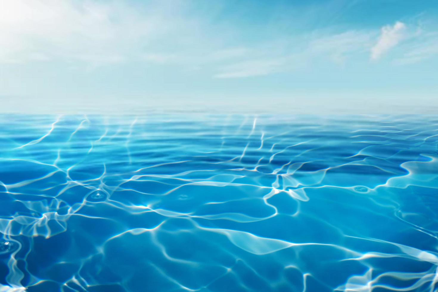 surface de l'eau bleue de la mer ou de l'océan et sous l'eau avec un ciel ensoleillé et nuageux photo