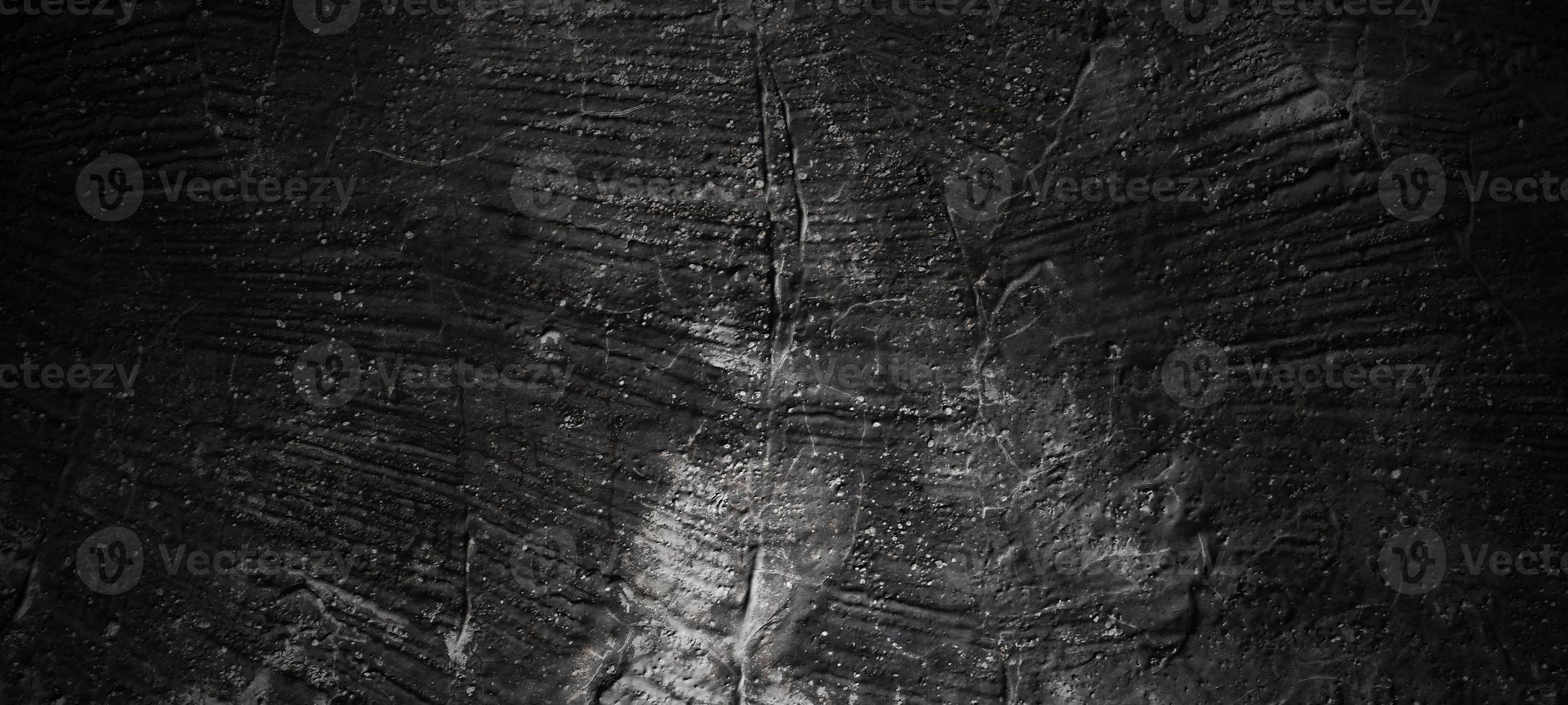 fond de pierre noir foncé. texture de béton noir effrayant. fond de mur de pierre. photo