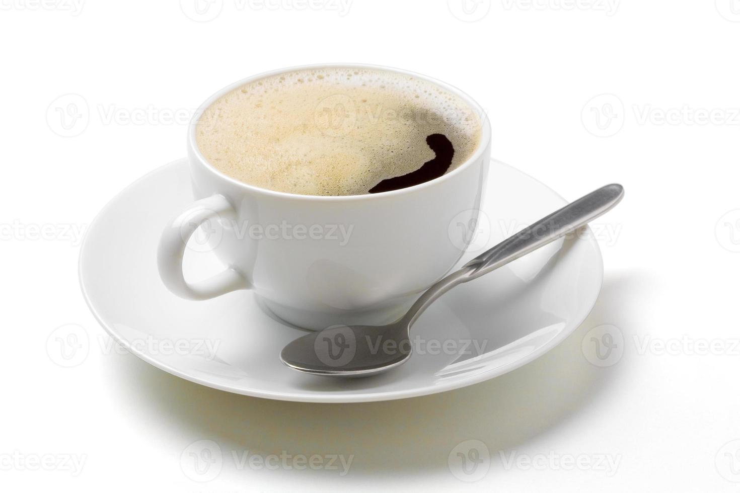 café cappuccino dans une tasse à café blanche avec soucoupe et cuillère photo