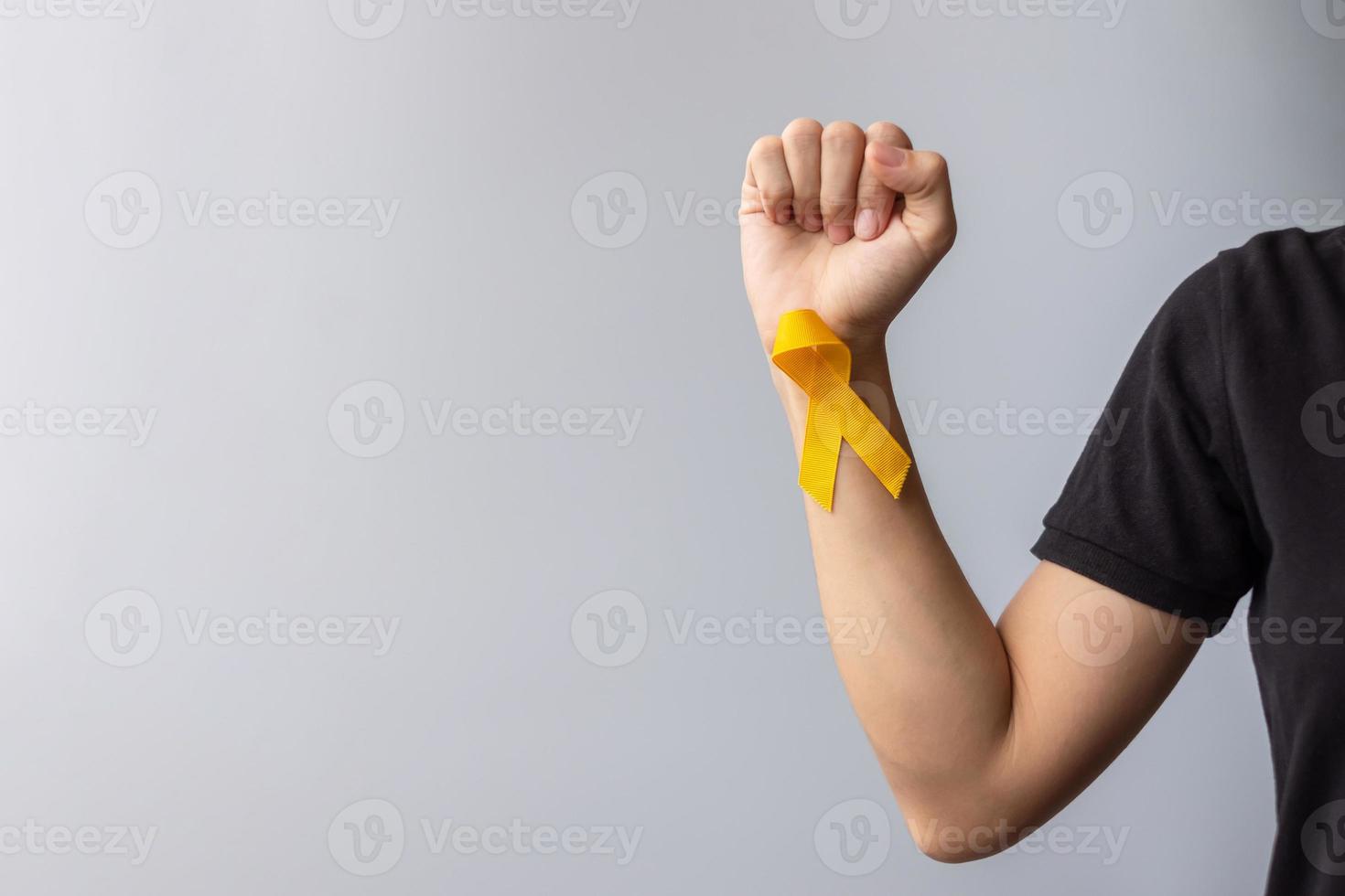 journée de prévention du suicide, enfance, sarcome, mois de sensibilisation au cancer des os et de la vessie, ruban jaune pour soutenir la vie et la maladie des personnes. santé des enfants et concept de la journée mondiale du cancer photo