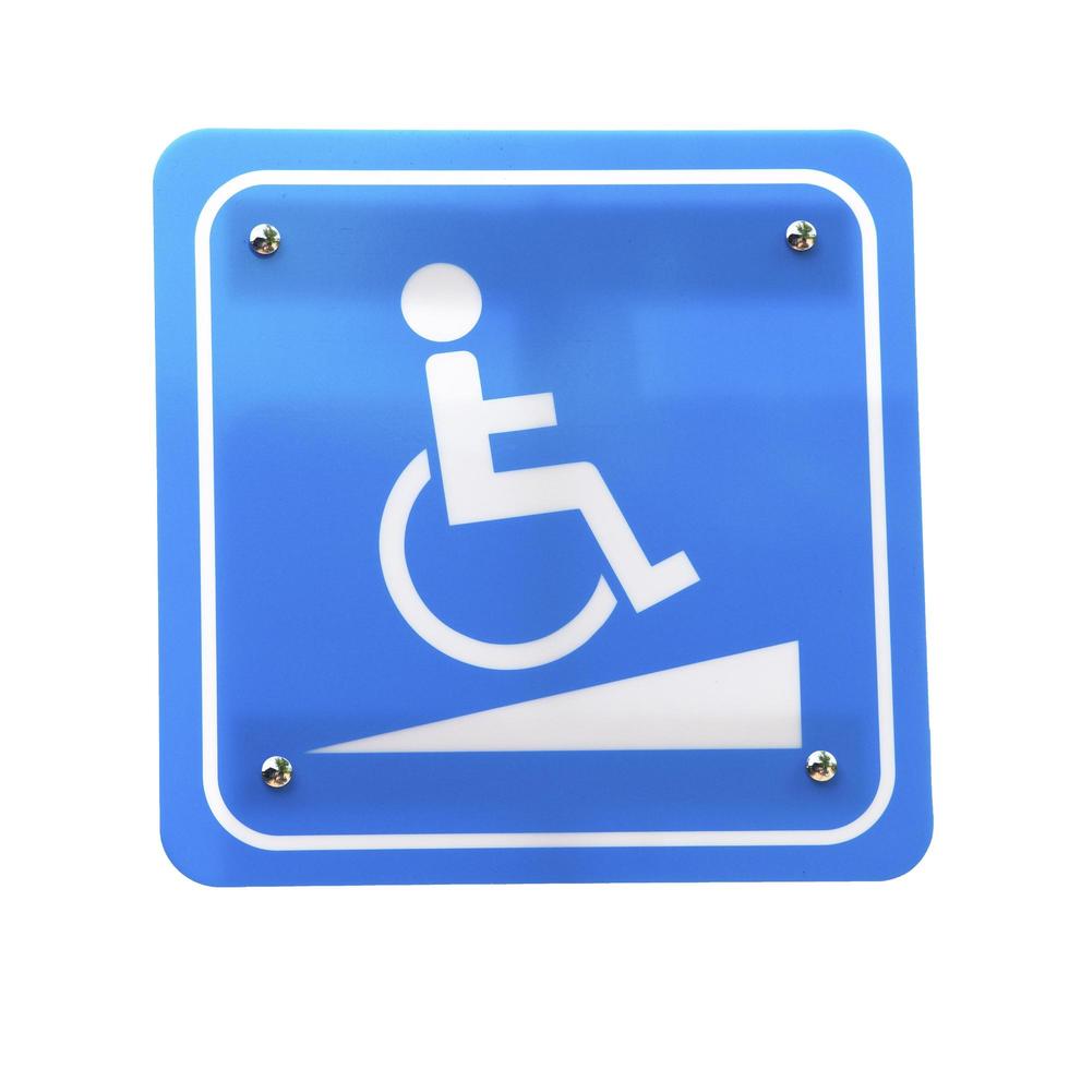 chemin d'icône pour fauteuil roulant sur fond bleu. photo