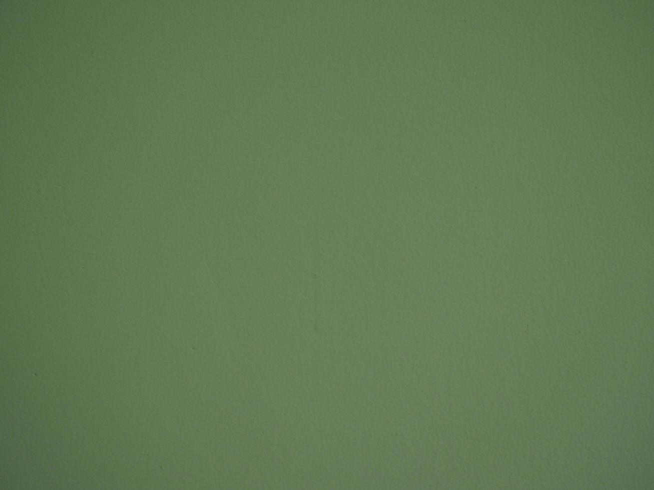 peindre la couleur verte sur le mur de ciment rugueux surface abstraite texture béton fond matériel photo