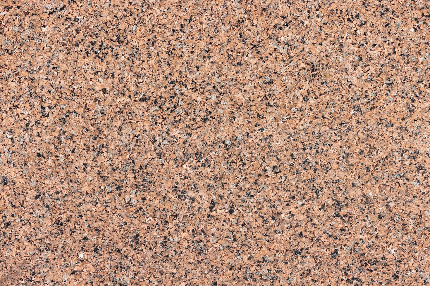 texture et fond de mur de granit tacheté de couleur marron. photo