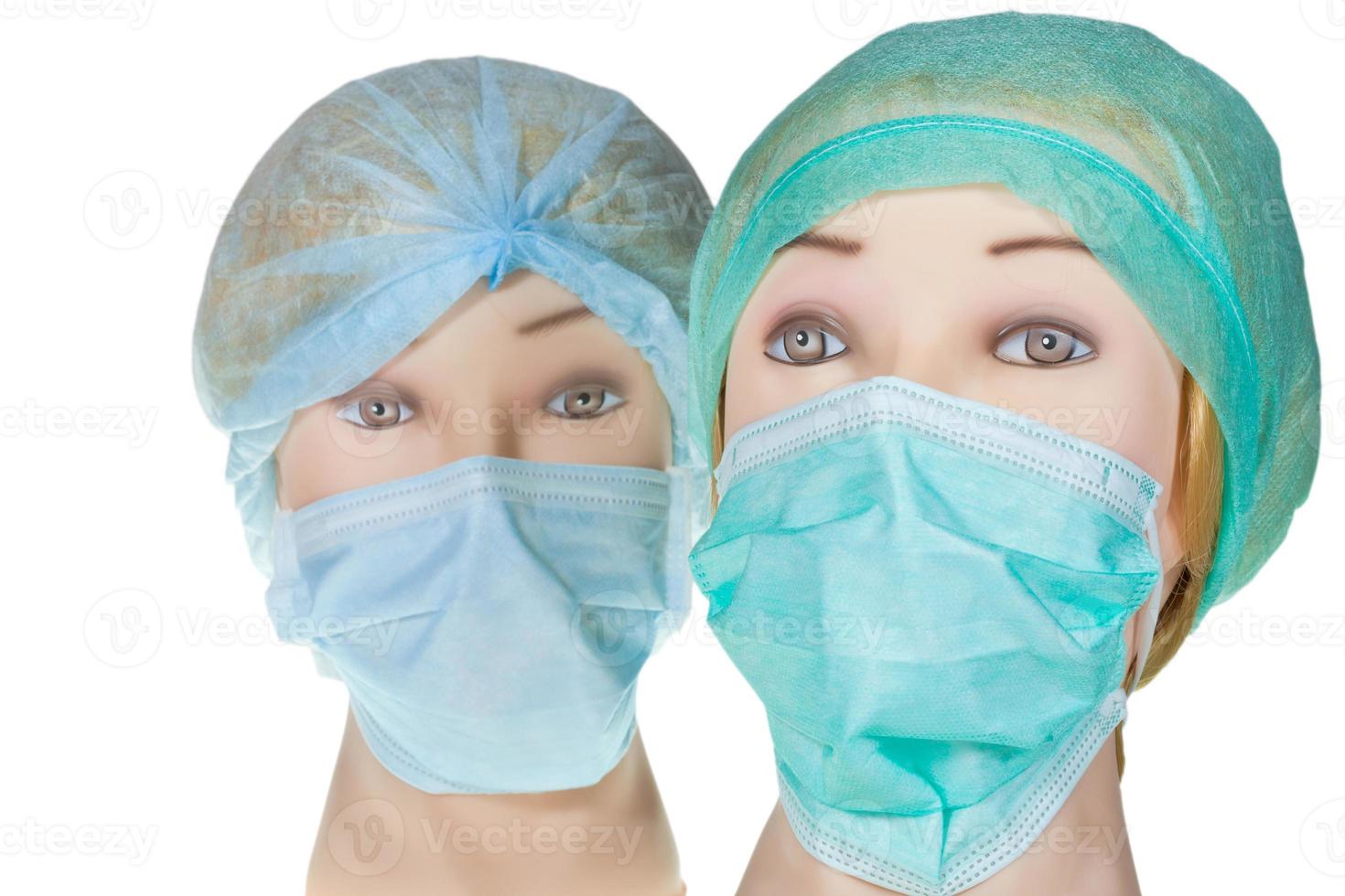 tête de médecin factice portant une casquette et un masque chirurgicaux en textile photo