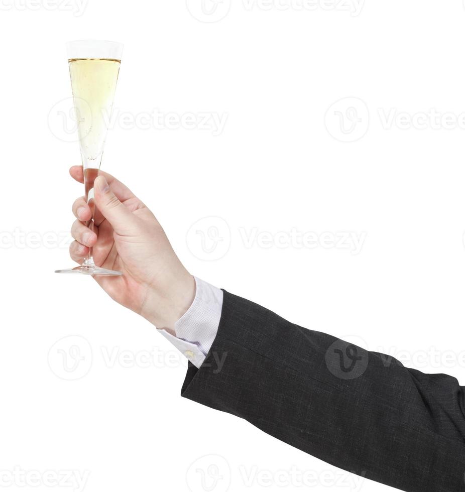 toast avec verre de champagne dans la main de l'homme d'affaires photo