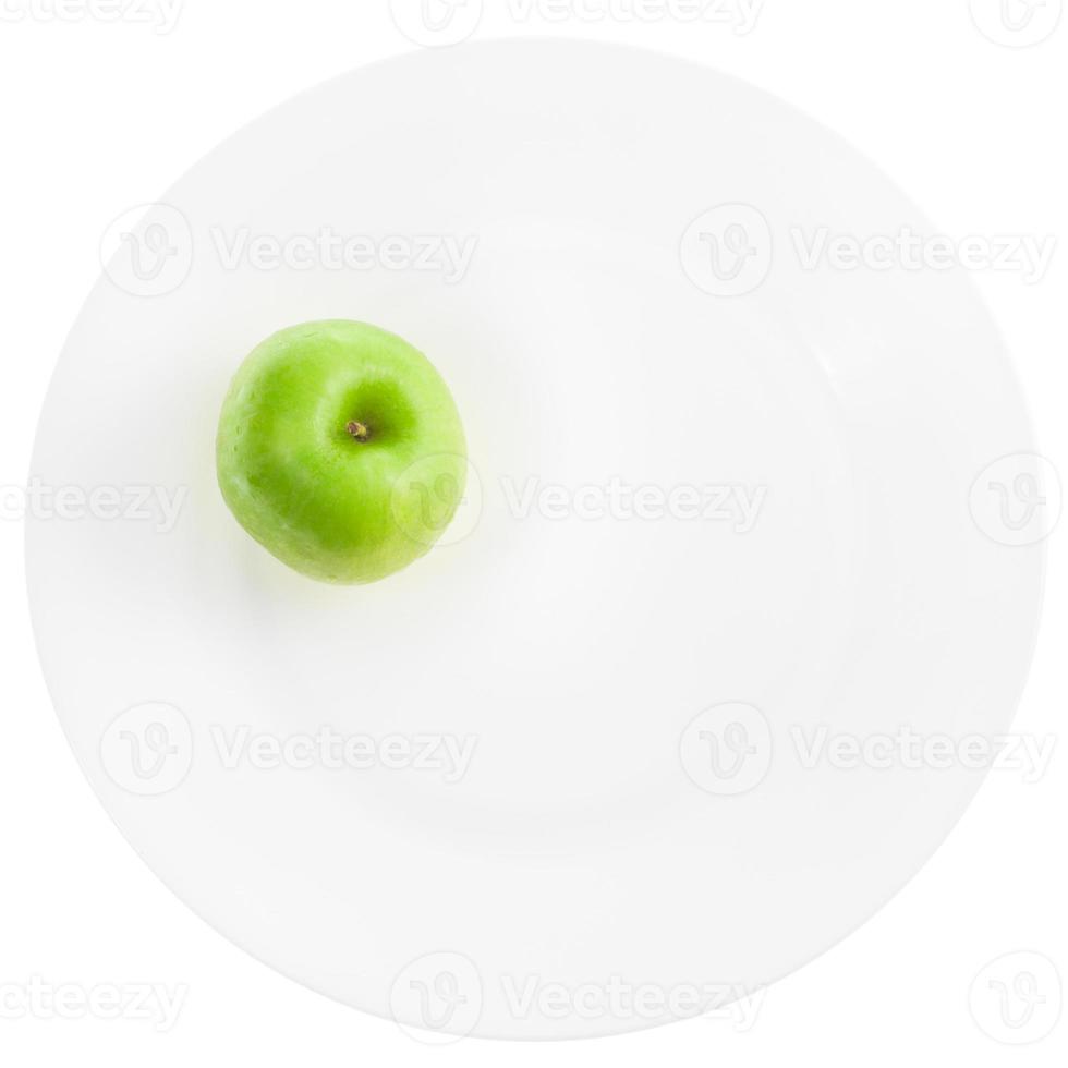 pomme verte sur plaque blanche photo