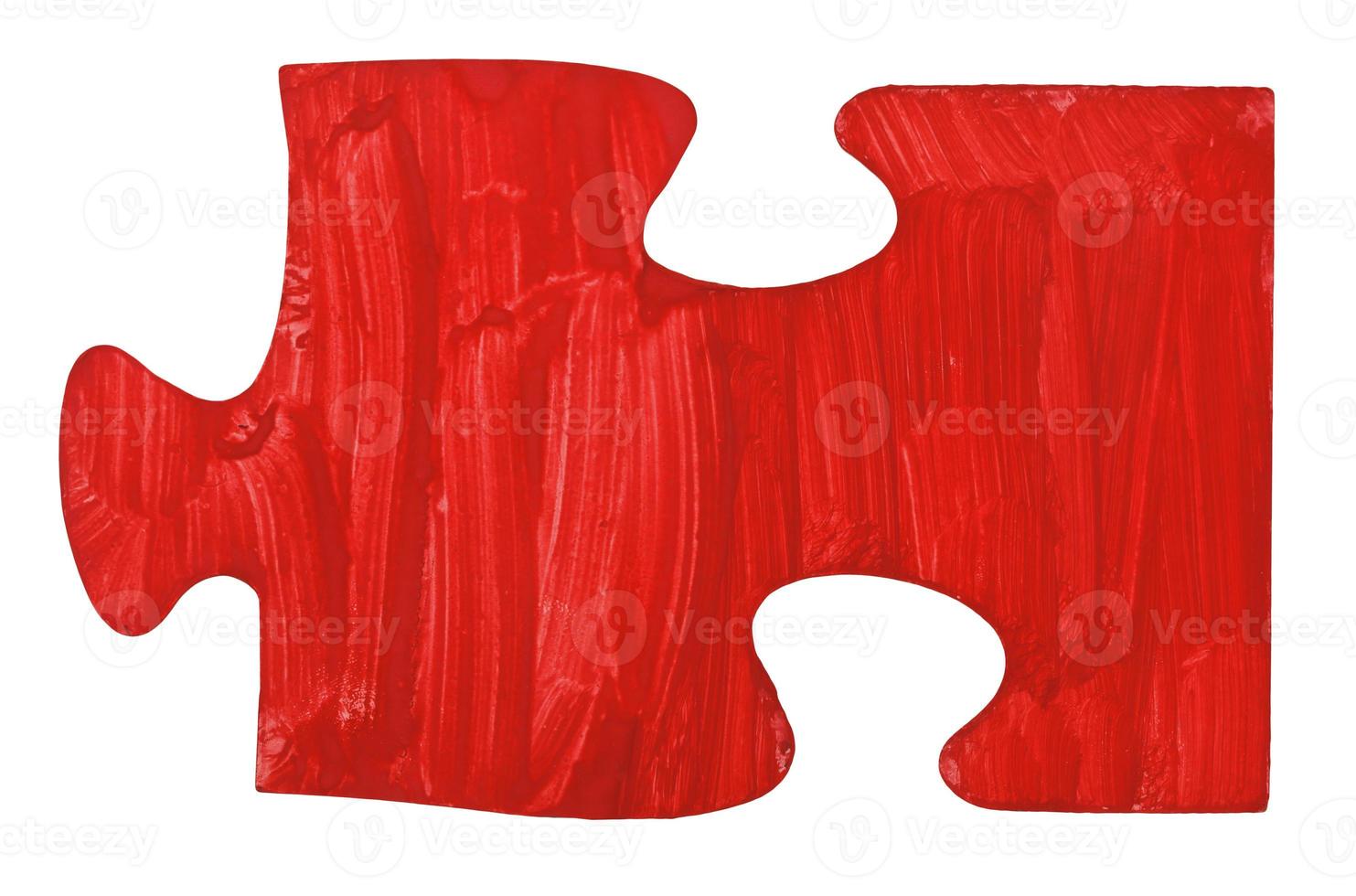 une pièce de puzzle rouge peinte à la main photo