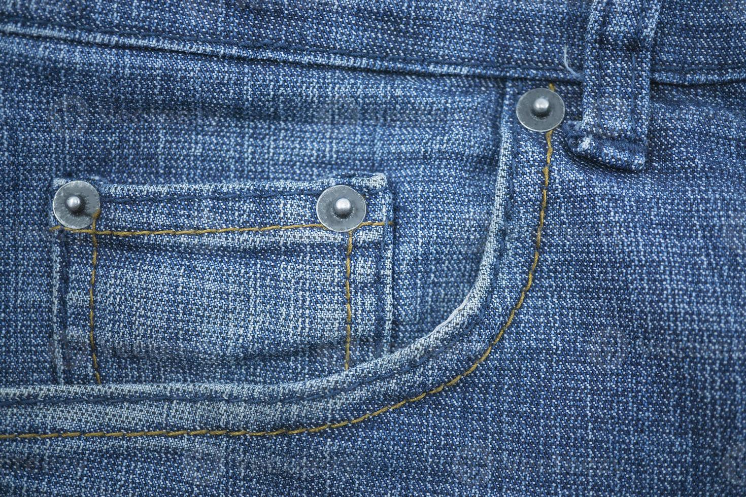 texture de fond de tissu de jeans bleu avec des détails de couture. photo