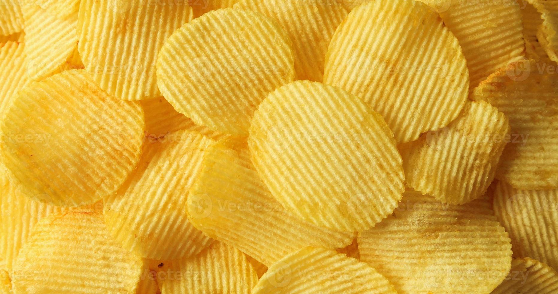 chips de pommes de terre croustillantes snack texture background closeup vue de dessus photo