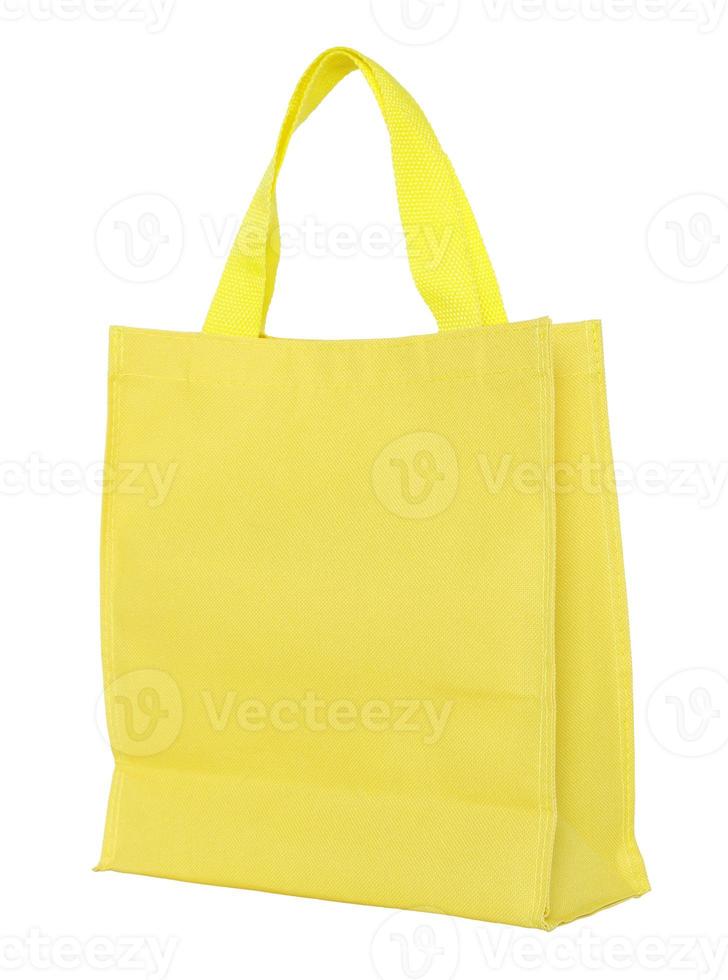 Sac à provisions en toile jaune isolé sur fond blanc avec un tracé de détourage photo