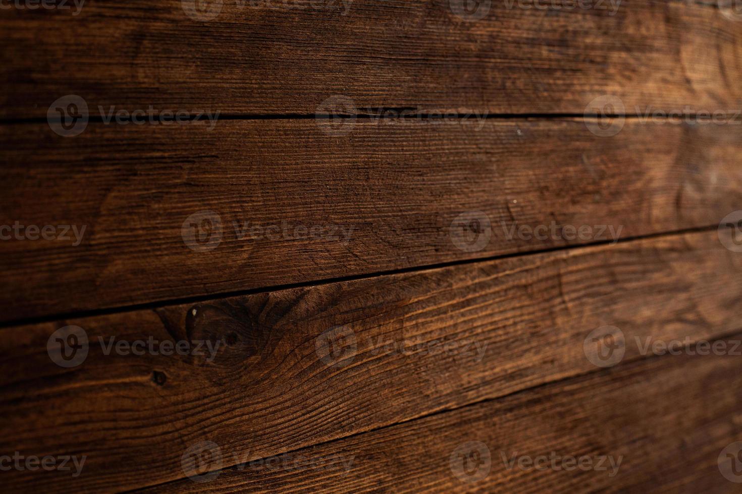 texture de fond en bois de couleur vintage avec noeuds et trous de clous. vieux mur en bois peint. planches horizontales sombres en bois. vue de face avec espace de copie. photo