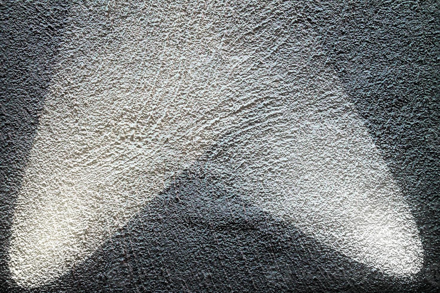 vue rapprochée sur les textures de mur en béton avec trois projecteurs photo