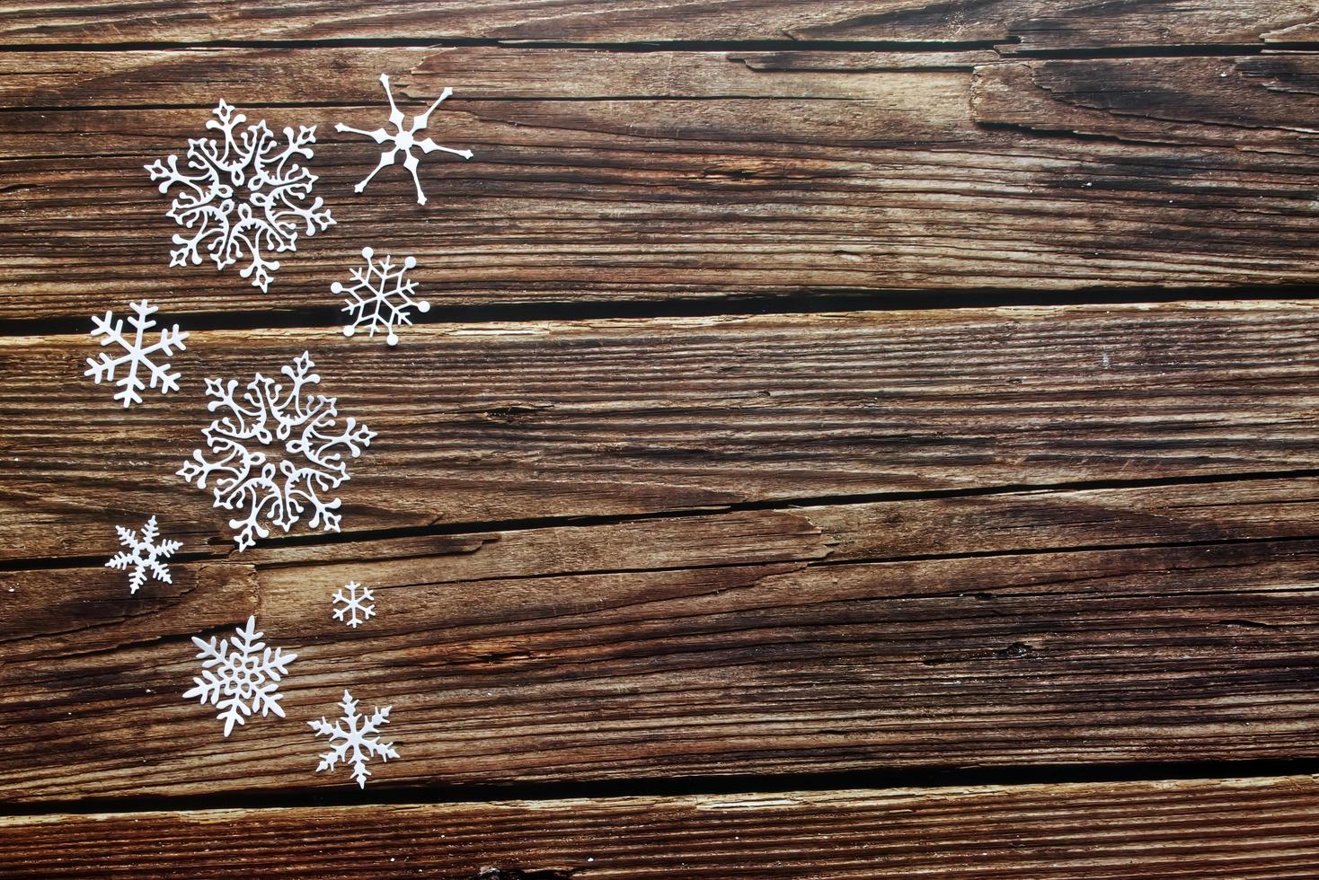 fond en bois de neige. fond avec flocon de neige, concept de célébration de noël. photo