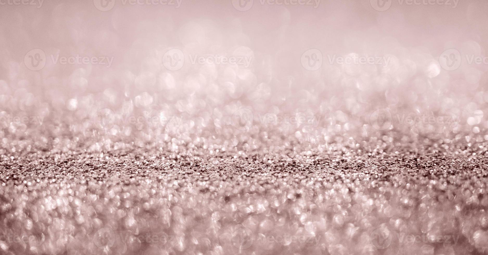 texture scintillante abstraite de paillettes d'or rose avec fond bokeh photo
