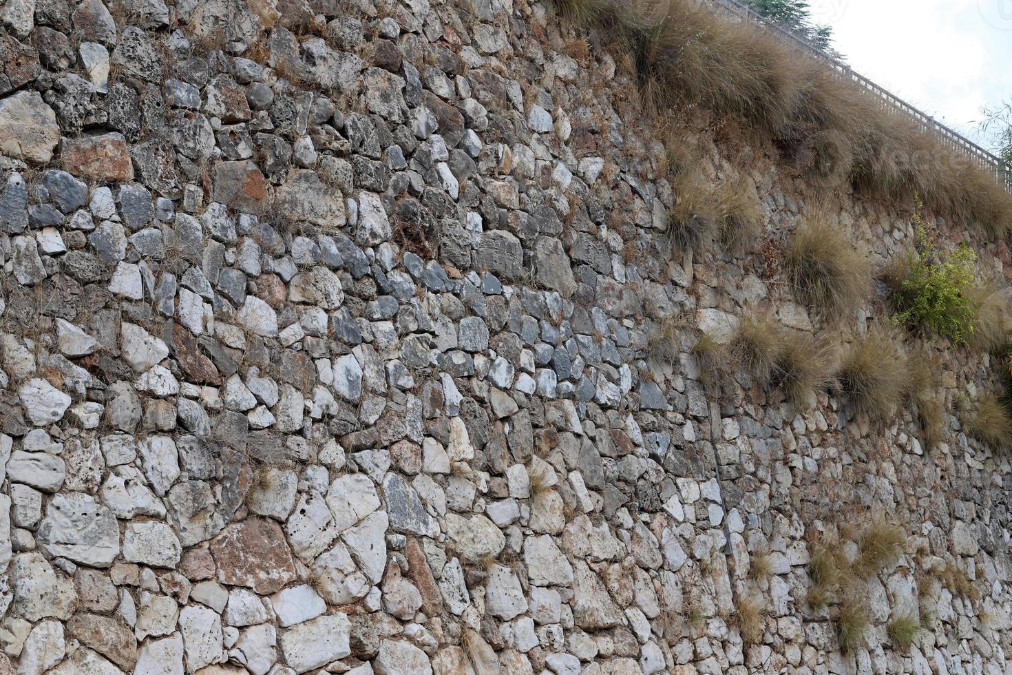 haut mur en pierre et béton. photo