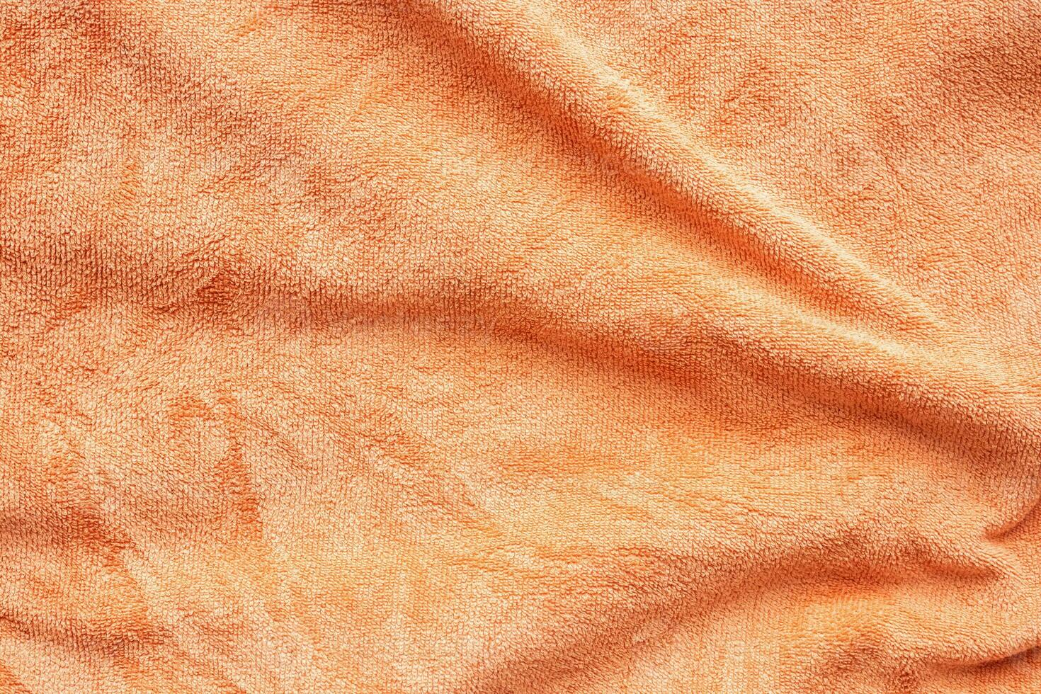 Surface de texture de tissu serviette orange gros plan arrière-plan photo
