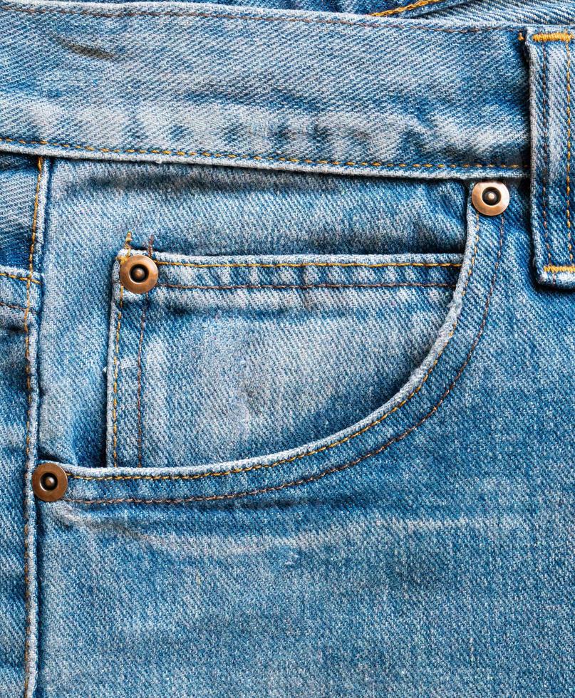 Poche de jeans denim bleu texture background closeup photo