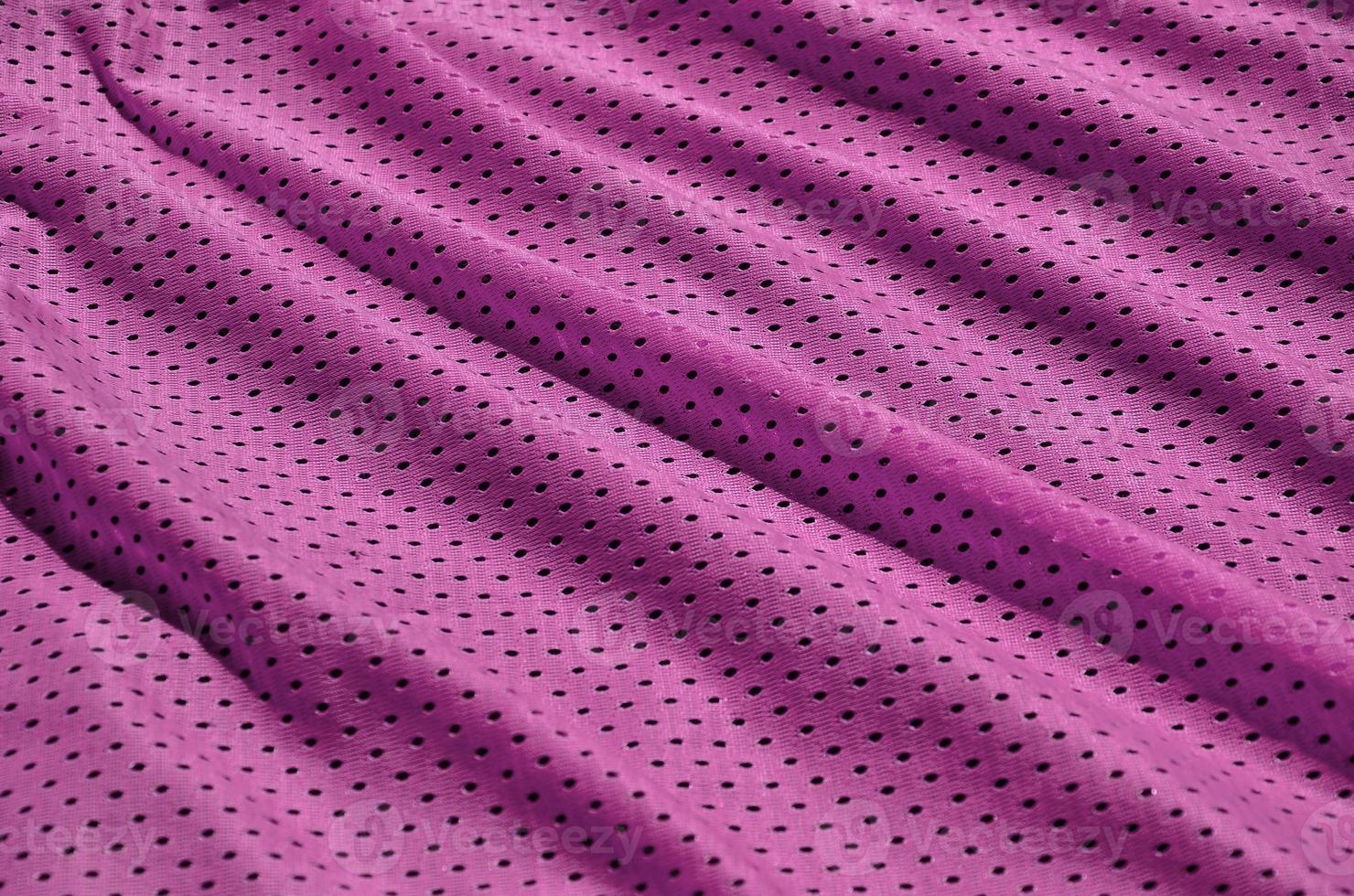 texture de vêtements de sport en fibre de polyester. les vêtements d'extérieur pour l'entraînement sportif ont une texture en maille de tissu en nylon extensible photo