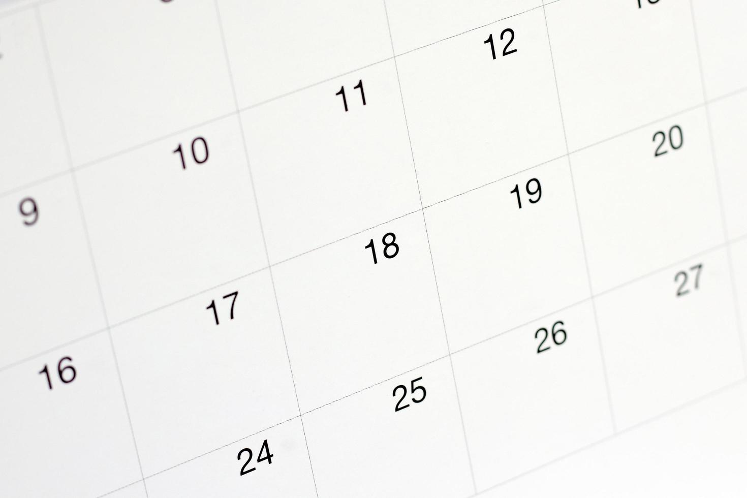 dates sur fond de page de calendrier, gros plan de nombres sur la page de calendrier photo