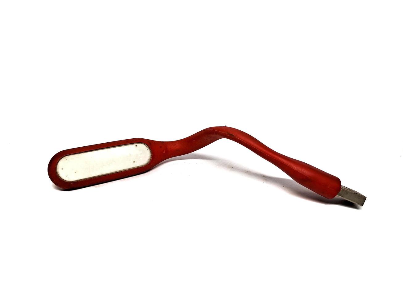 bâton lumineux à led rouge pouvant être utilisé comme banque d'alimentation, fond blanc photo