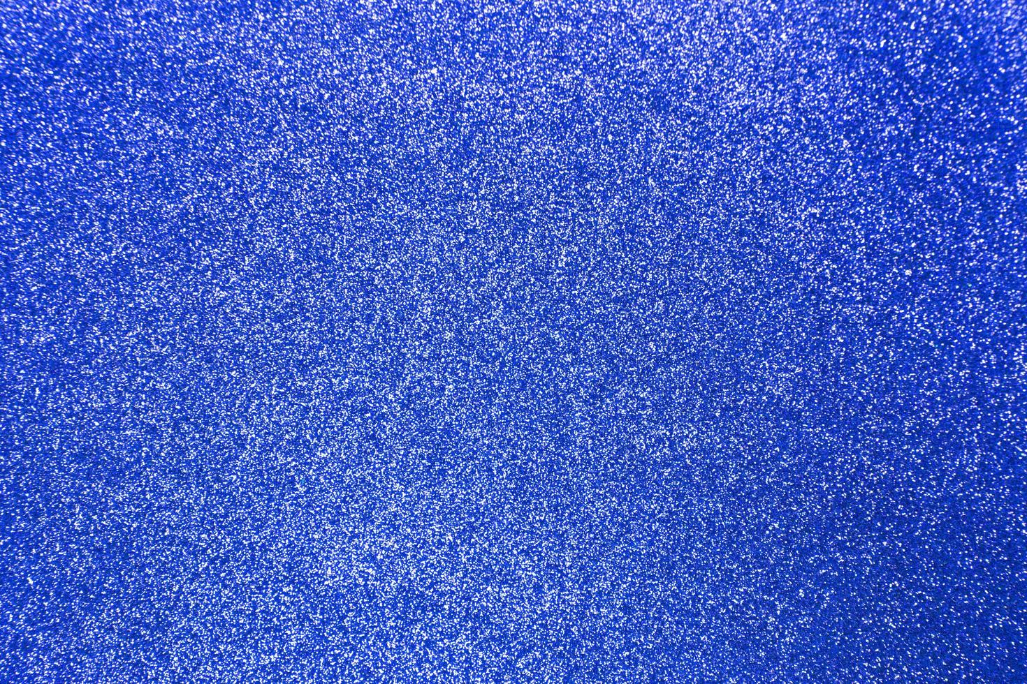 fond de texture brillante de paillettes bleu foncé pour noël photo