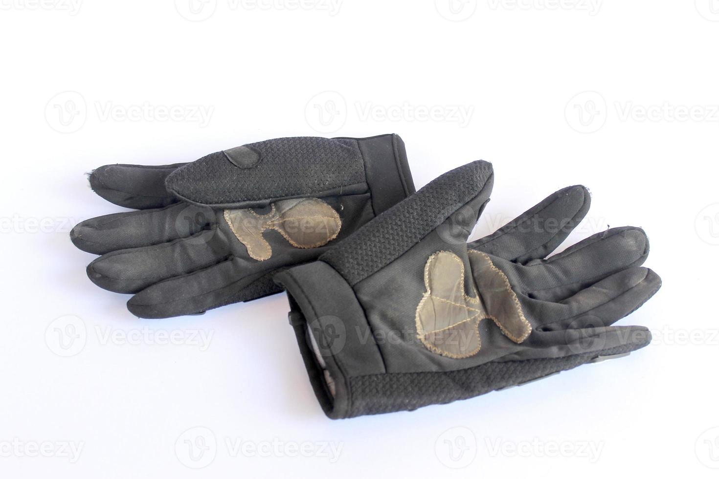 vieux gants noirs sales. photo