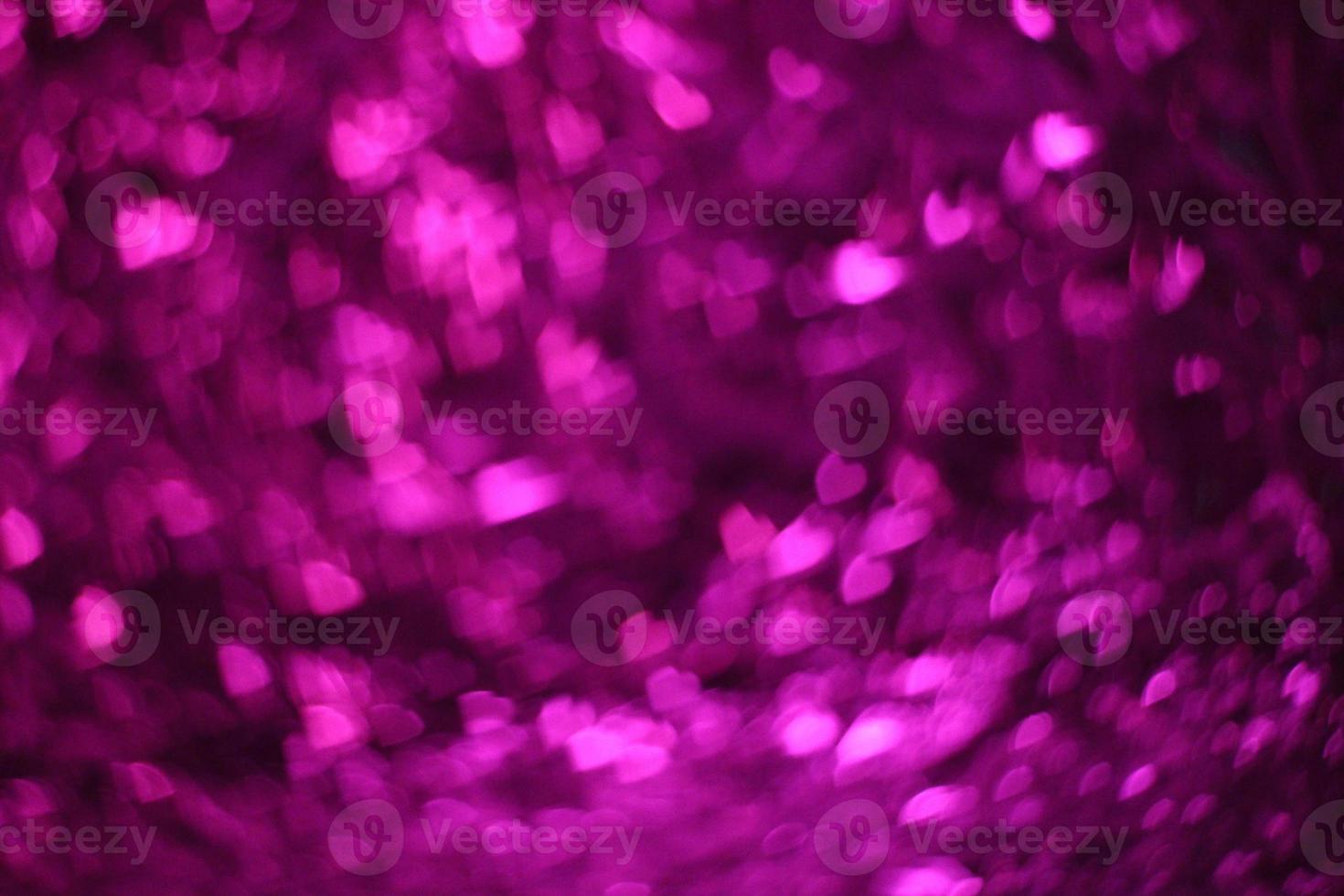 fond de bokeh de coeurs violets, résumé de bokeh violet parfait pour un arrière-plan de la Saint-Valentin à venir. photo