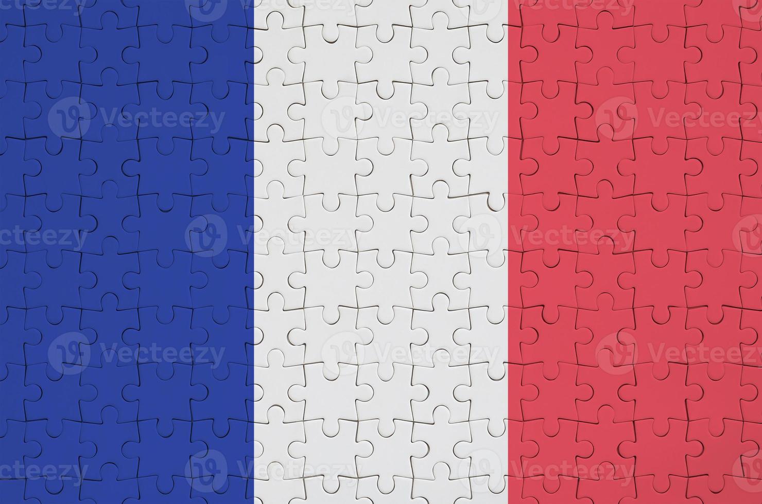 le drapeau de la france est représenté sur un puzzle plié photo