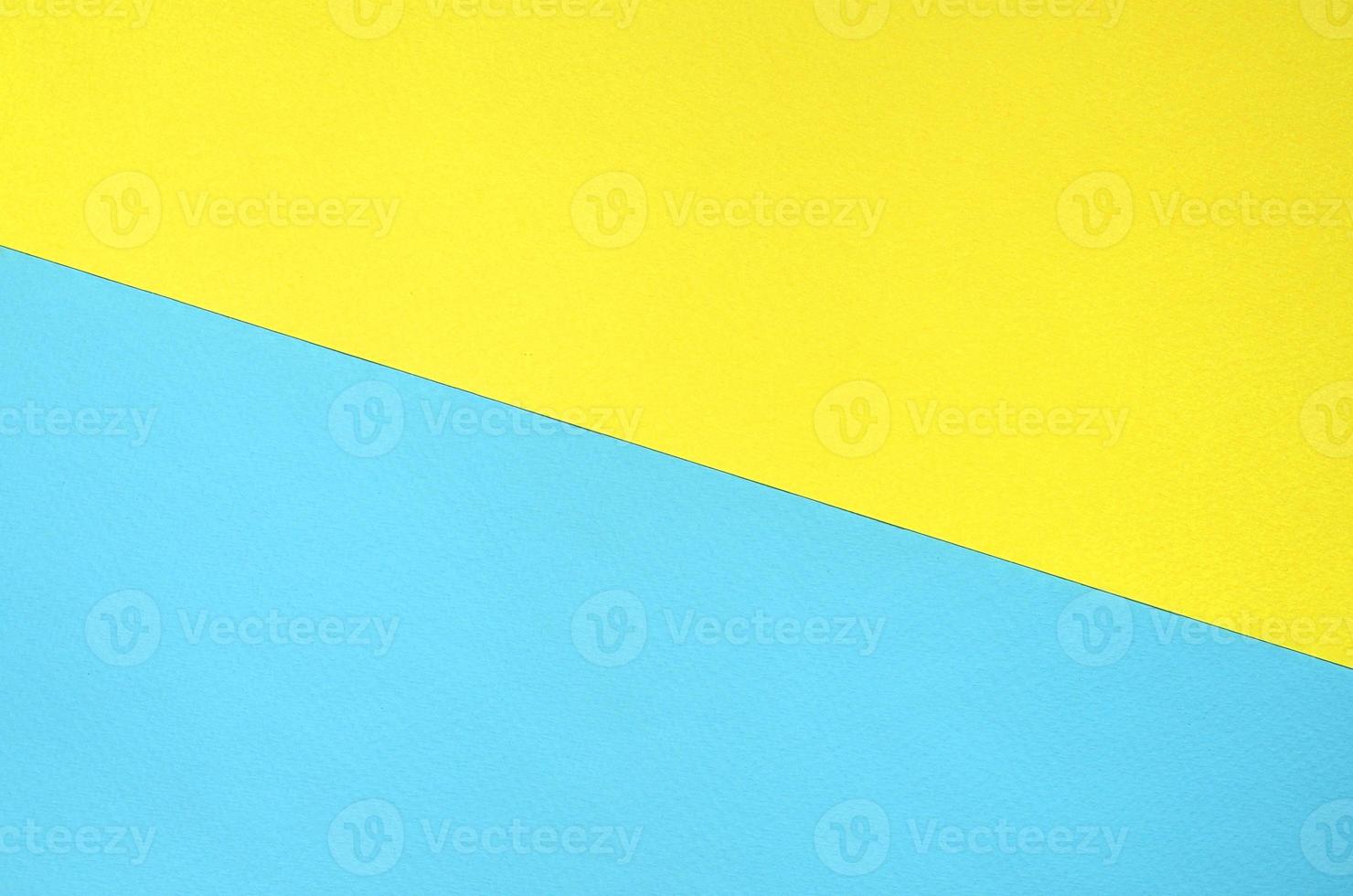 fond de texture de couleurs pastel de mode. papiers à motifs géométriques jaunes et bleus. résumé minimal photo