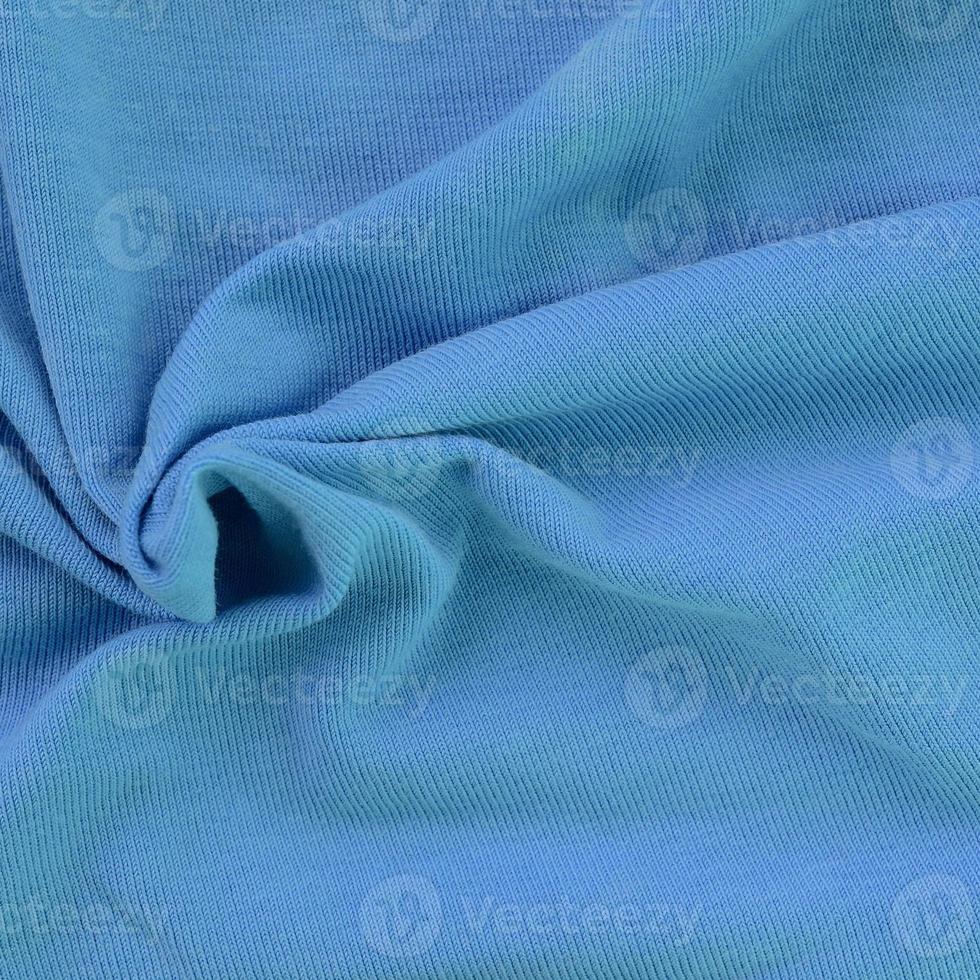 la texture du tissu de couleur bleue. matériel pour faire des chemises et des chemisiers photo