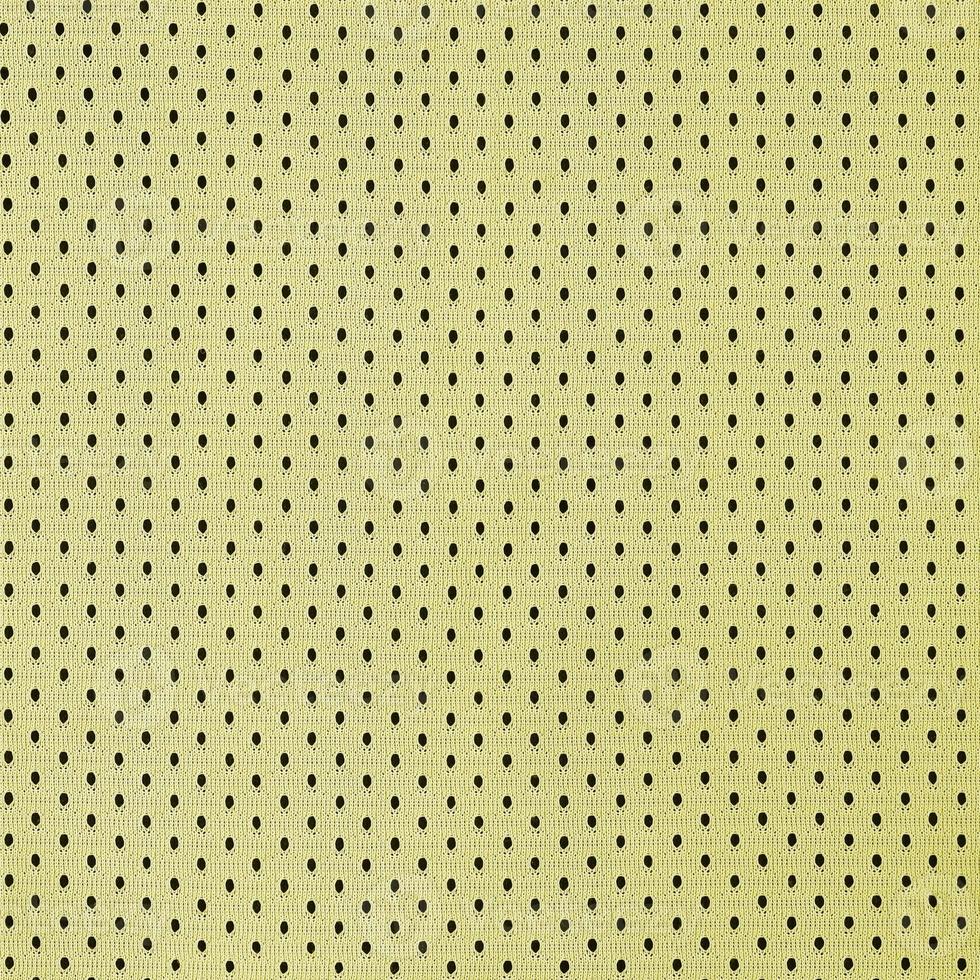 motif de fond textile en tissu de vêtements de sport en maille jaune photo