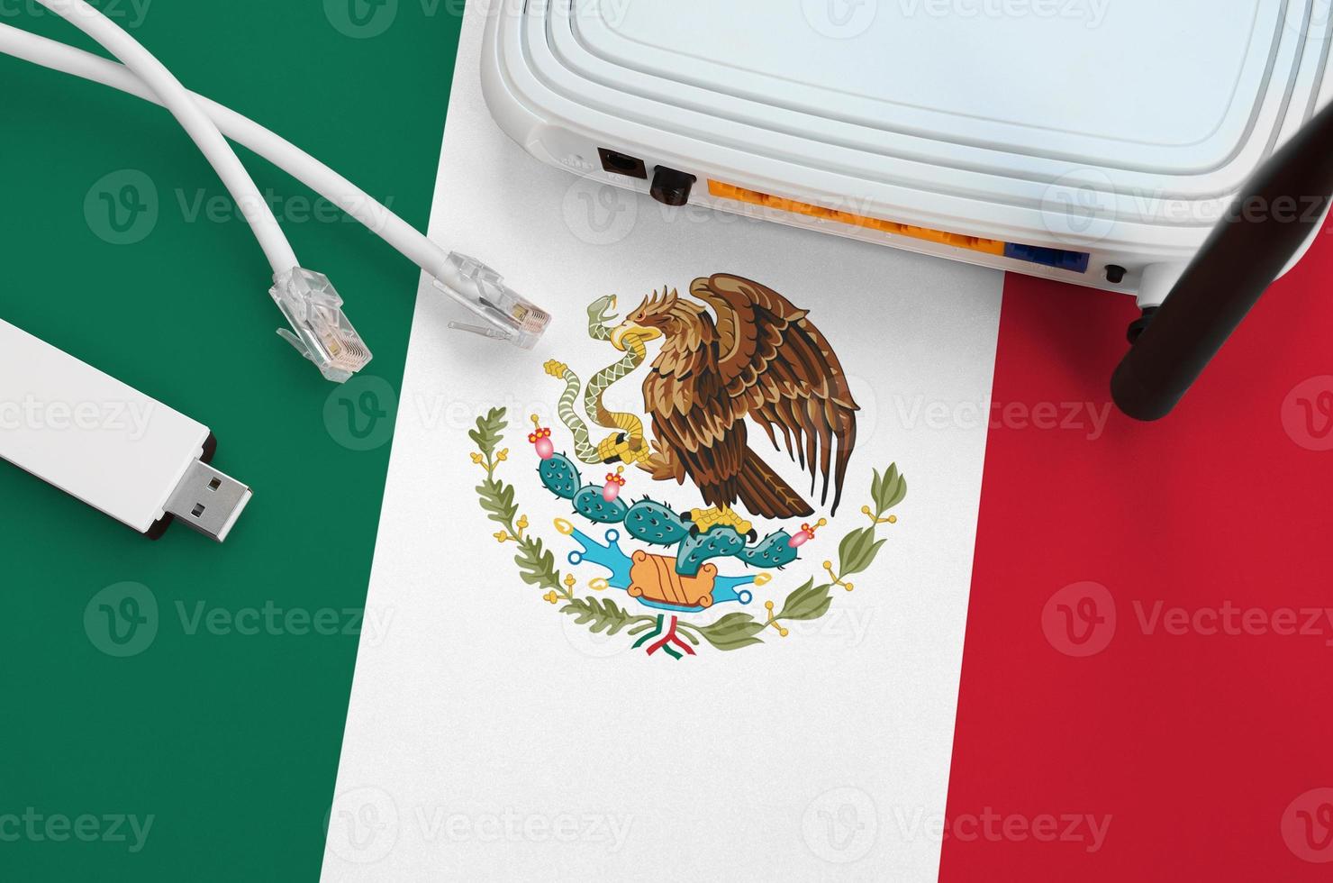 drapeau mexicain représenté sur une table avec câble internet rj45, adaptateur wifi usb sans fil et routeur. notion de connexion internet photo