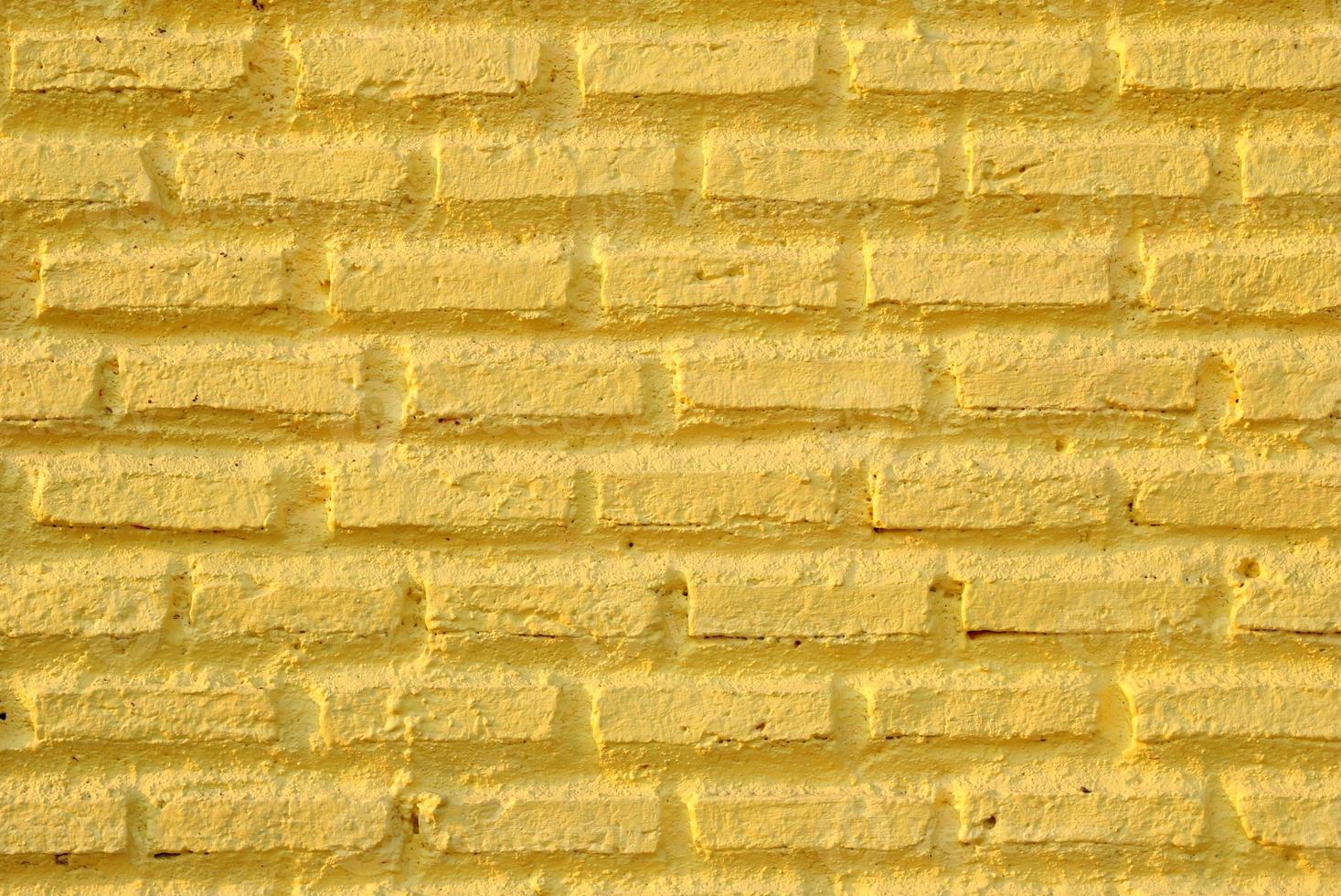 mur jaune de briques pour le fond. photo