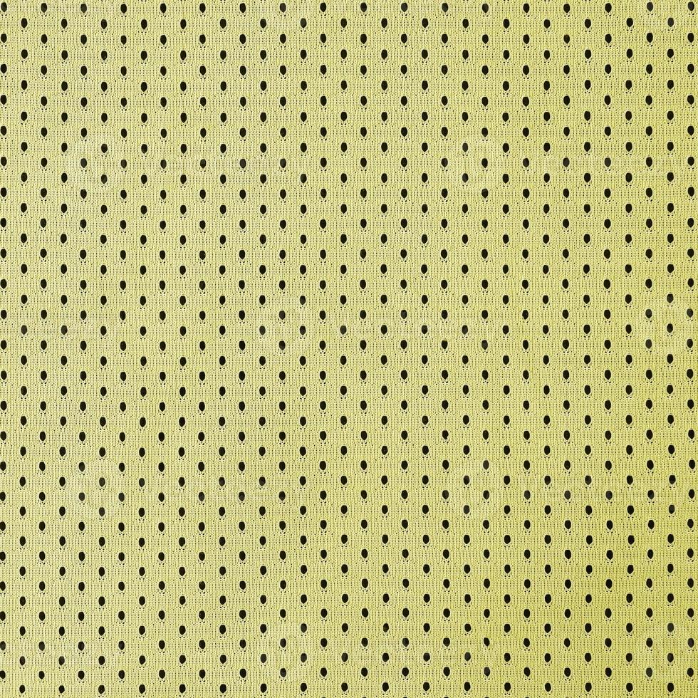 motif de fond textile en tissu de vêtements de sport en maille jaune photo