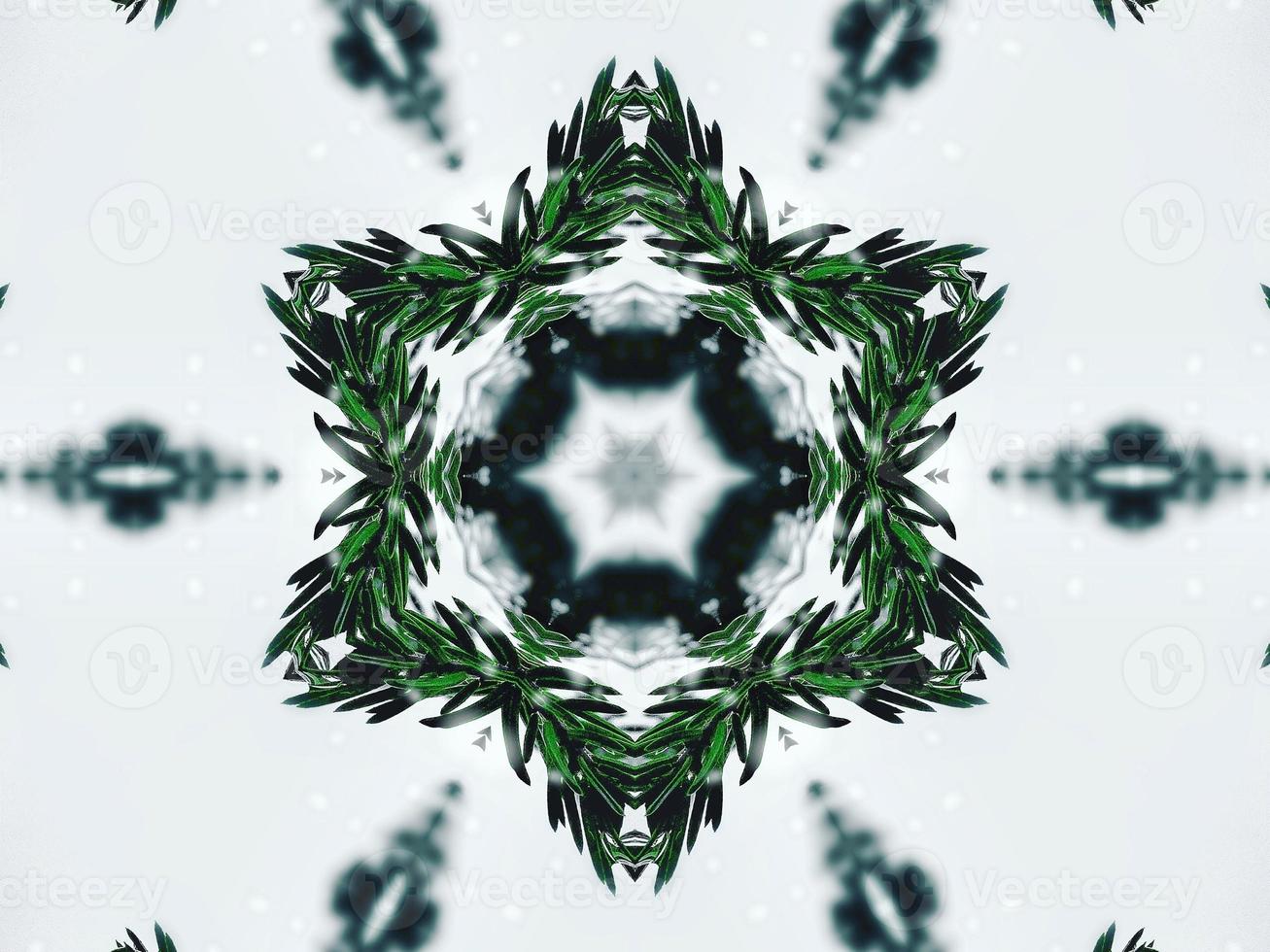 feuilles vertes floues fond kaléidoscope fleur abstraite et motif symétrique pour les vibrations de noël photo