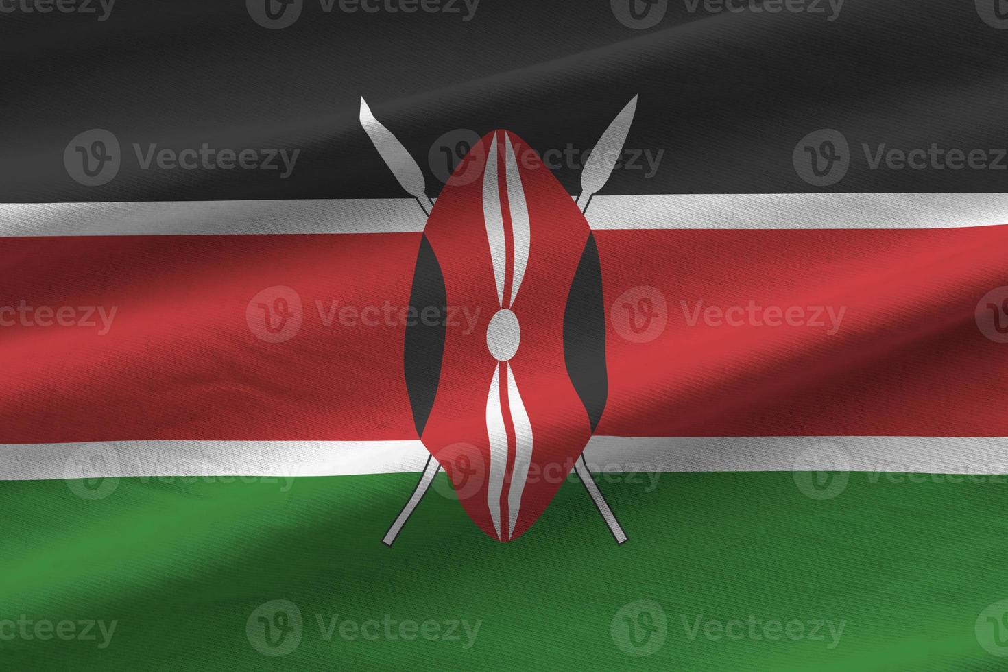 drapeau du kenya avec de grands plis agitant de près sous la lumière du studio à l'intérieur. les symboles et couleurs officiels de la bannière photo