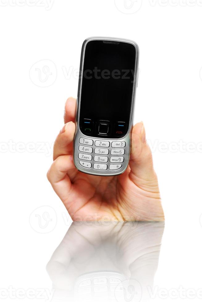 mains tenant un téléphone portable photo