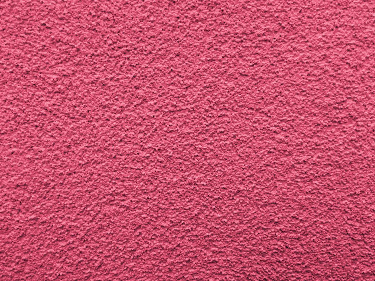 surface texturée du mur. viva magenta, couleur pantone de l'année 2023 photo