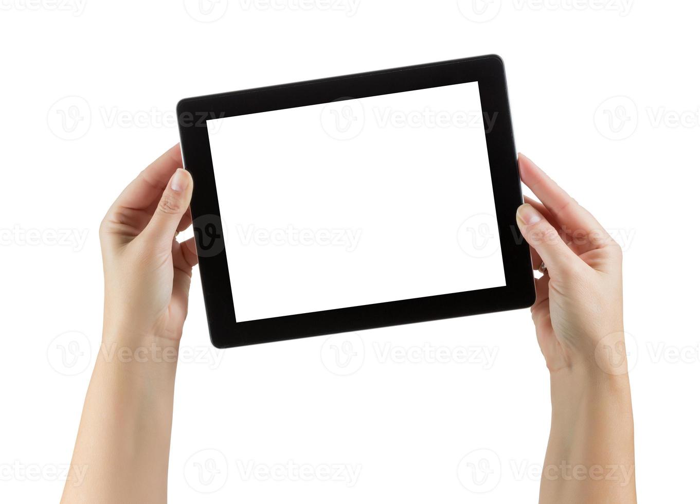 mains féminines tenant une tablette d'ordinateur vierge sur blanc photo