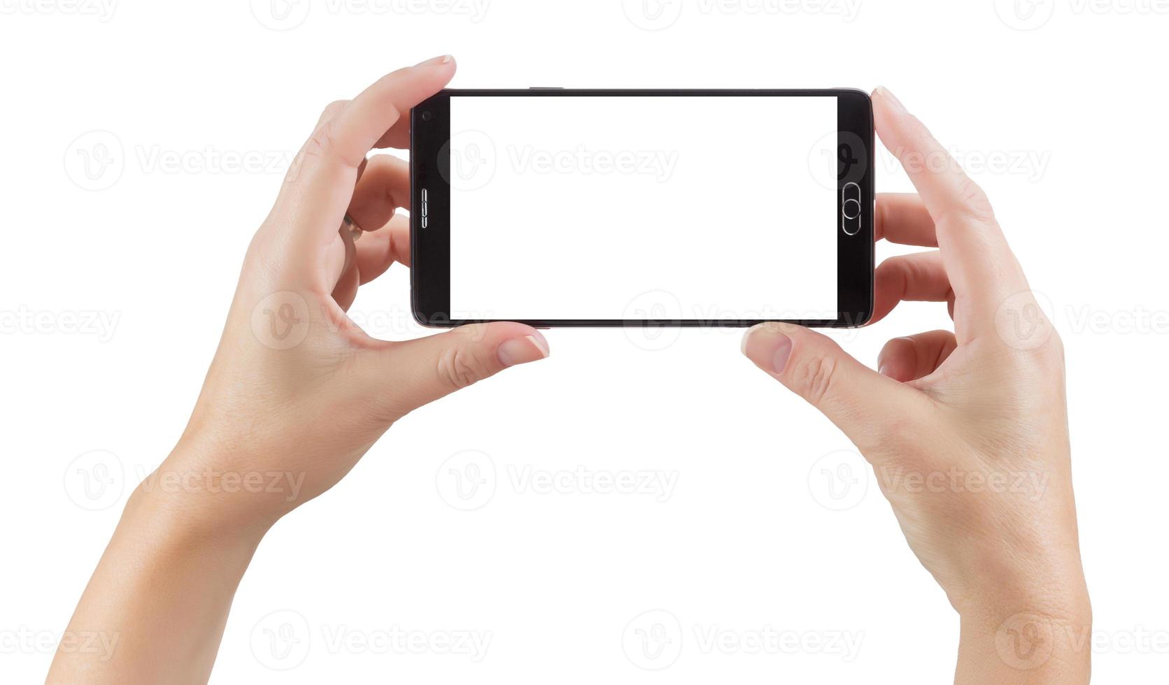mains féminines tenant un téléphone intelligent avec écran blanc sur blanc photo
