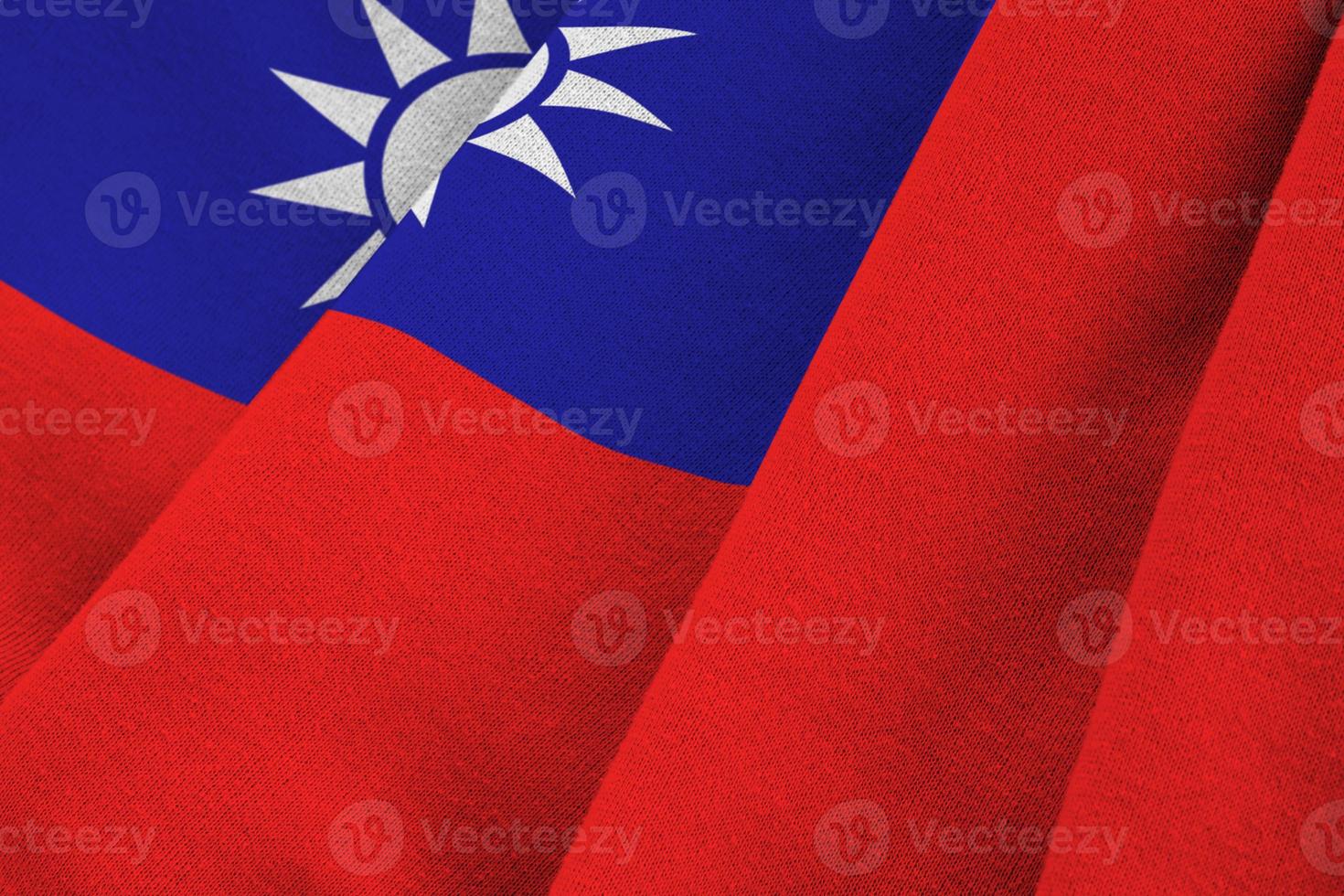 drapeau de taiwan avec de grands plis agitant de près sous la lumière du studio à l'intérieur. les symboles et couleurs officiels de la bannière photo