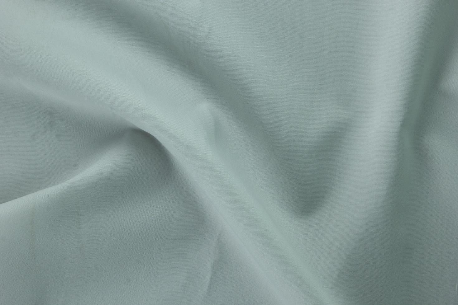 8 texture de coton blanc lisse, fond de soie incurvé, motif. texture de tissu de soie blanche. belle soie douce émeraude. photo
