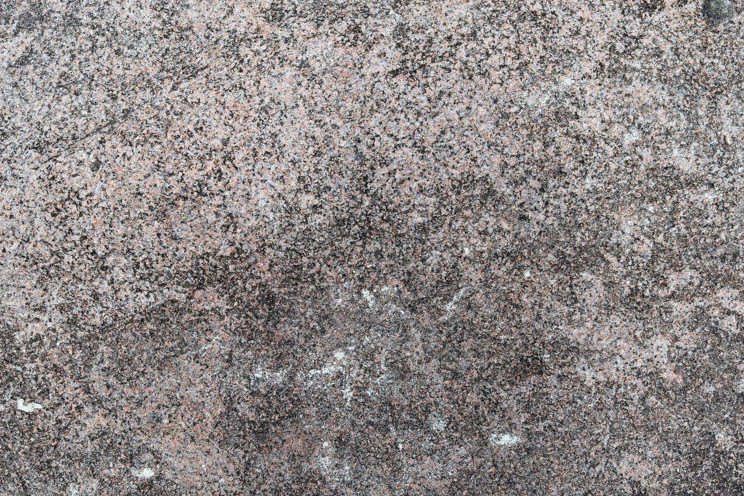 vue rapprochée sur une texture de mur de granit et de pierre en haute résolution. photo