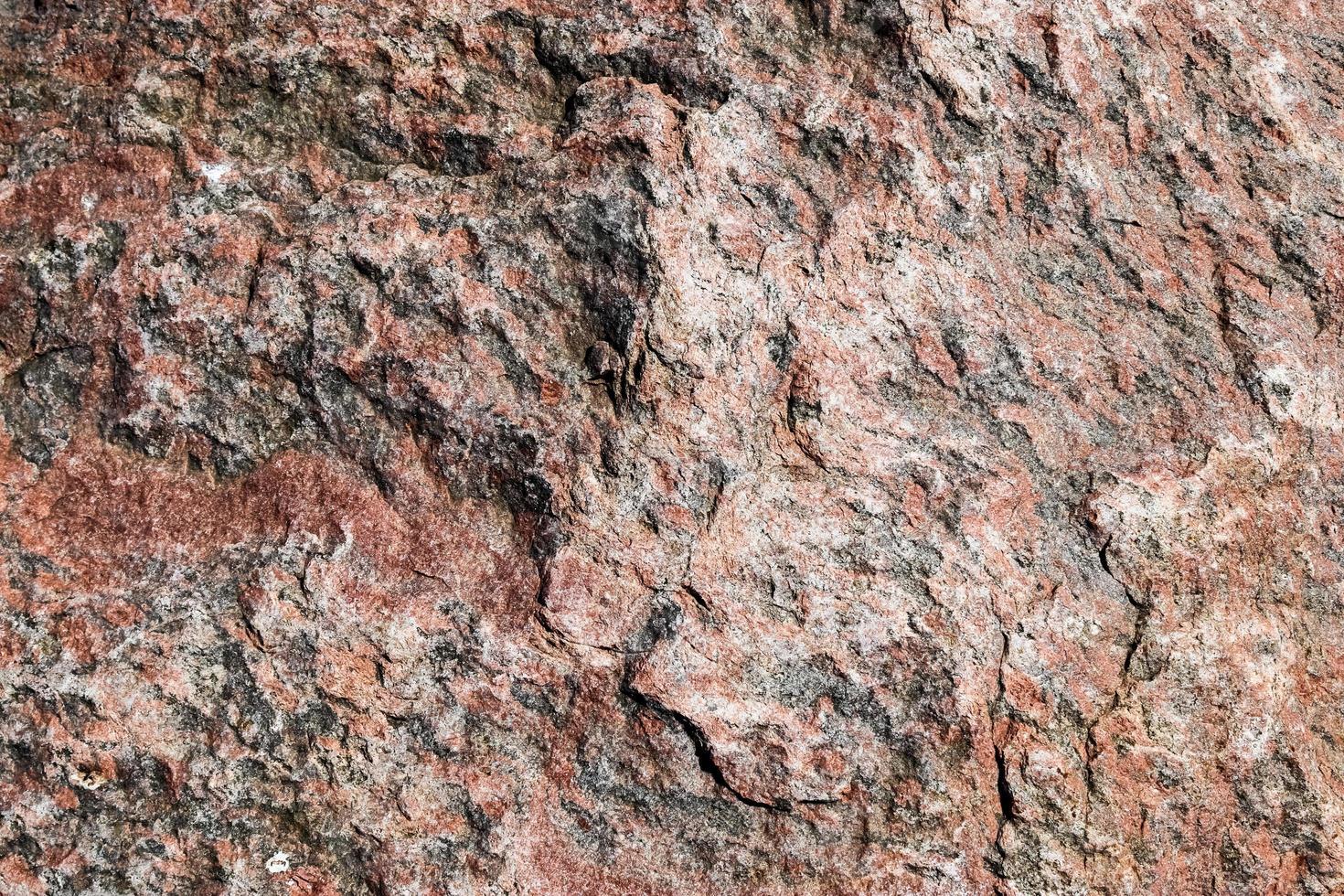 Vue en gros plan sur un mur de granit et de pierre dans une texture de location photo